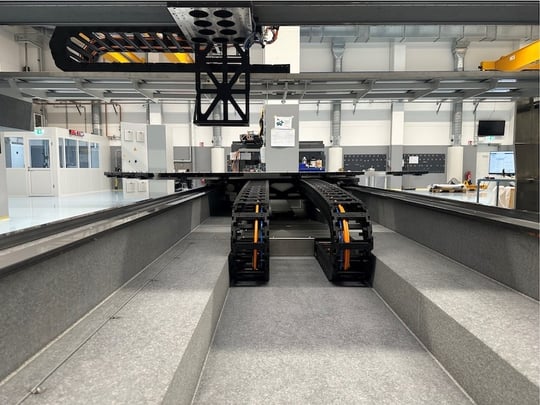 rontal top view of motion system with two parallel guided energy chains on granite base