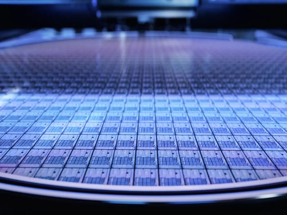 Close-up of a wafer in semiconductor production. Precise production of electronic circuits for microprocessors and chip technology.